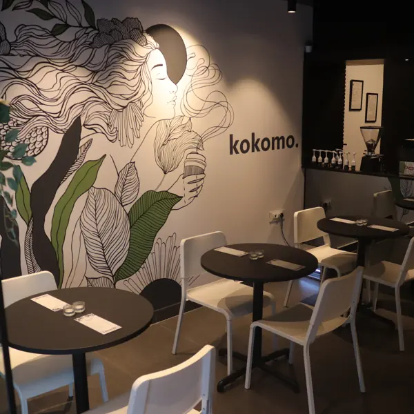 The line-art mural and tables